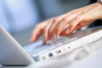 Hands of Businesswoman Using Laptop